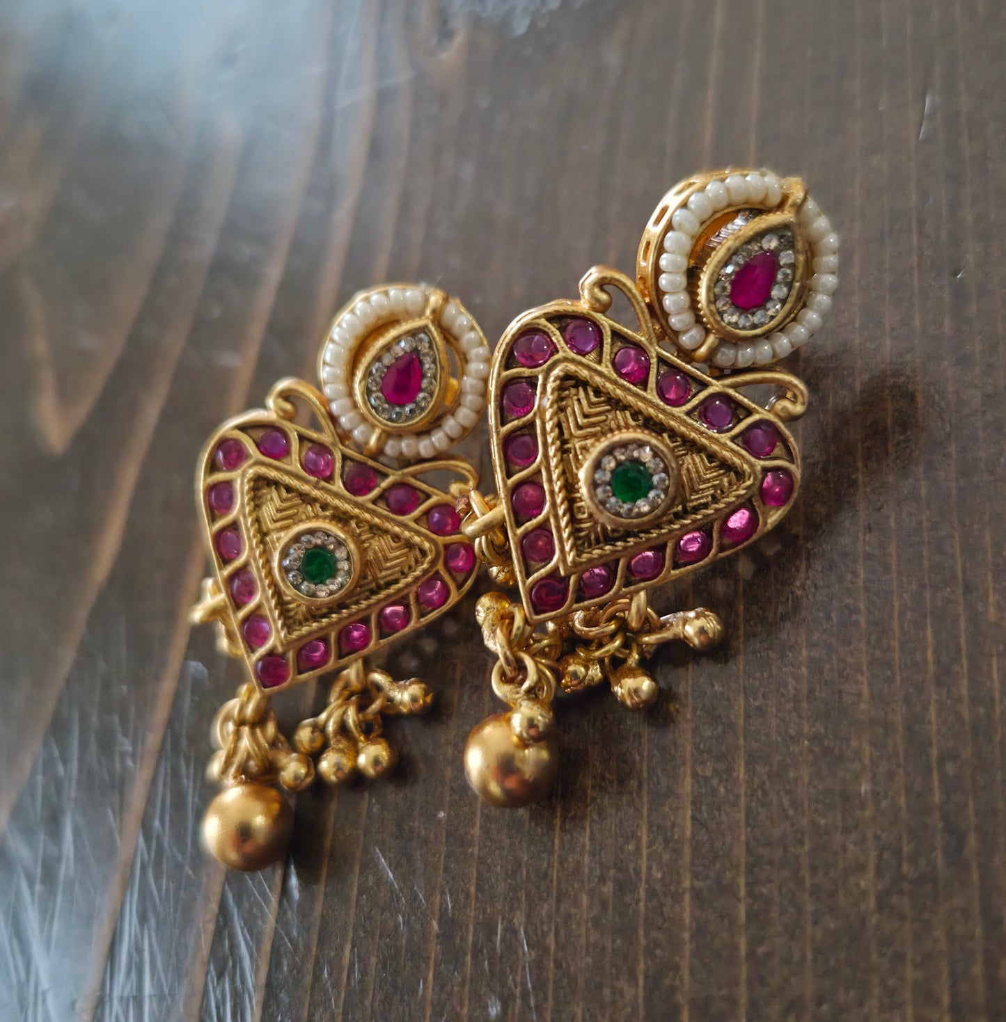 Trikone gold finish studs