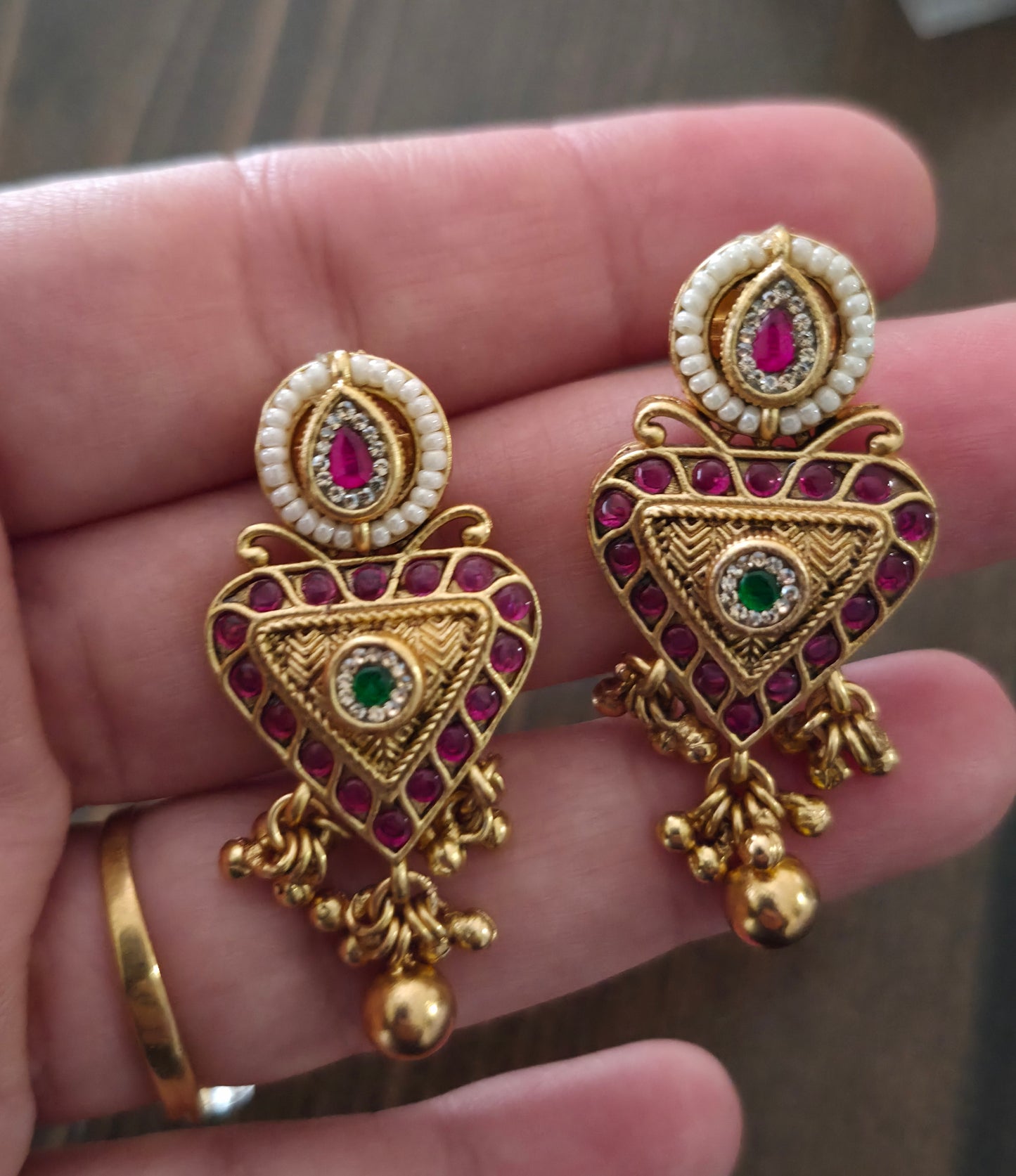 Trikone gold finish studs