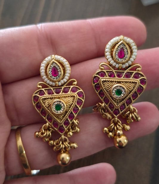 Trikone gold finish studs