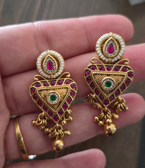 Trikone gold finish studs